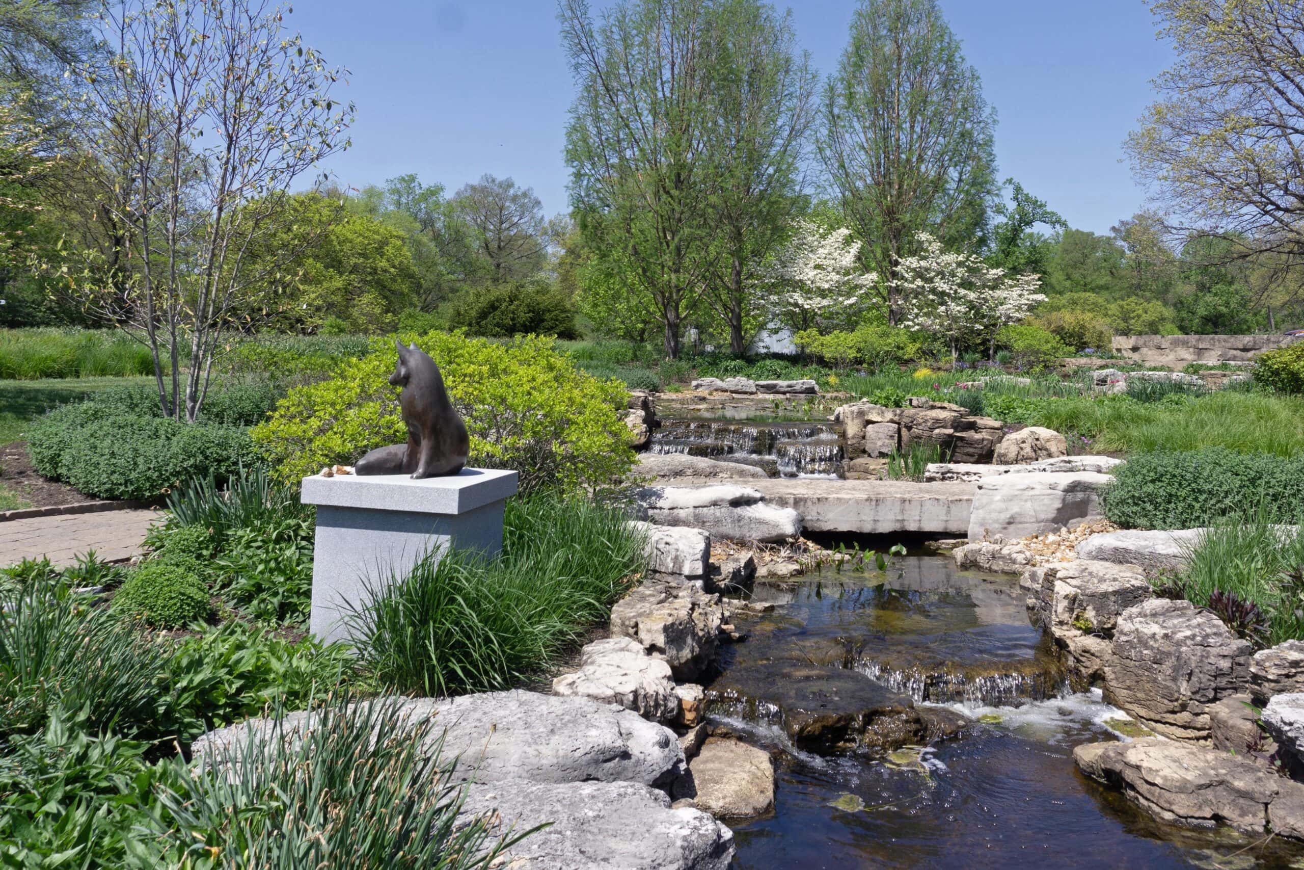 The columbarium garden in Bellefontaine Cemetery features a cascading stream